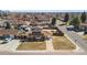 Charming single-story home with solar panels, a well-maintained lawn, and a driveway leading to an attached garage at 96 S Depew Dr, Lakewood, CO 80226