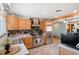Spacious kitchen with stainless steel appliances and backsplash and wooden cabinets at 96 S Depew Dr, Lakewood, CO 80226
