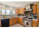 Well-equipped kitchen boasting stainless steel appliances and attractive cabinetry at 96 S Depew Dr, Lakewood, CO 80226