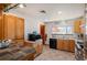 Bright kitchen featuring wooden cabinets, a tile backsplash, and ample countertop space at 96 S Depew Dr, Lakewood, CO 80226