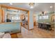 Open-concept kitchen and dining area with stainless steel appliances and natural light at 96 S Depew Dr, Lakewood, CO 80226