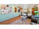 Comfortable living room with a grey sofa, round coffee table, and decorative artwork at 96 S Depew Dr, Lakewood, CO 80226