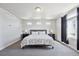 Bedroom featuring a neutral color palette, three horizontal windows, a large window, and overhead lighting at 18066 E 104Th Way, Commerce City, CO 80022