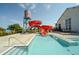 Reunion's vibrant red water slide offers exciting splashdowns into the clear community pool at 18066 E 104Th Way, Commerce City, CO 80022