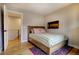 Comfortable bedroom with wood flooring, colorful rug, and tranquil decor at 2471 S High St, Denver, CO 80210