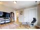 Relaxing bonus room with hardwood floors, media center, and reading nook at 2471 S High St, Denver, CO 80210