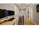 Bright hallway with a home office at the end, showcasing a dedicated workspace, and lots of natural light at 2471 S High St, Denver, CO 80210