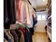 Well-organized walk-in closet featuring built-in shelving, hanging rods, and ample storage for clothes, shoes, and accessories at 2471 S High St, Denver, CO 80210