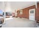 Covered brick patio with access to backyard at 2994 S Winona Ct, Denver, CO 80236