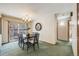 Bright dining room features a table with chairs and access to the backyard at 2994 S Winona Ct, Denver, CO 80236