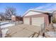 Detached two-car brick garage with double doors at 2994 S Winona Ct, Denver, CO 80236