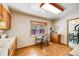 Kitchen with wood cabinets, white appliances and a breakfast nook by the window at 2994 S Winona Ct, Denver, CO 80236