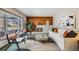 Living room with a fireplace and large windows at 2994 S Winona Ct, Denver, CO 80236