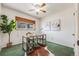 Home office features built-in shelving and a large window at 2994 S Winona Ct, Denver, CO 80236