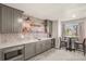 Finished basement bar with stylish decor, wine cooler and modern finishes at 907 Greenridge Ln, Castle Pines, CO 80108