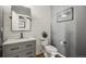 Modern powder room with shiplap walls and updated fixtures at 907 Greenridge Ln, Castle Pines, CO 80108