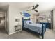 Bedroom with blue decor, a ceiling fan and a connected bathroom at 907 Greenridge Ln, Castle Pines, CO 80108