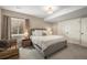 Comfortable bedroom with a neutral color scheme, closet and a large window at 907 Greenridge Ln, Castle Pines, CO 80108