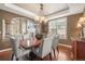 Formal dining room with tray ceiling and hardwood floors at 907 Greenridge Ln, Castle Pines, CO 80108