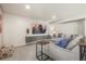 Cozy living room features a large sectional, shiplap wall and custom storage at 907 Greenridge Ln, Castle Pines, CO 80108