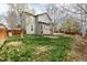 Green backyard with a wooden deck and fence, perfect for outdoor enjoyment at 16434 Homestead Ct, Parker, CO 80134