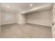 Finished basement featuring neutral carpet, recessed lighting, and a window at 16434 Homestead Ct, Parker, CO 80134