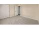 Carpeted bedroom with an open door and closet to the left at 16434 Homestead Ct, Parker, CO 80134