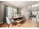 Bright dining room with hardwood floors and a view through the windows at 16434 Homestead Ct, Parker, CO 80134