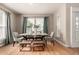 Stylish dining room with hardwood floors, modern table setting, and lots of light at 16434 Homestead Ct, Parker, CO 80134