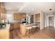 Charming kitchen with wood cabinets, granite counters, and an island with seating at 16434 Homestead Ct, Parker, CO 80134