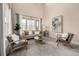 Bright living room featuring a large window, modern furniture, and neutral tones at 16434 Homestead Ct, Parker, CO 80134