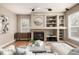 Cozy living room features a fireplace with built-in shelving and natural light at 16434 Homestead Ct, Parker, CO 80134