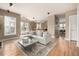 Open-concept living room with hardwood floors and access to the kitchen at 16434 Homestead Ct, Parker, CO 80134