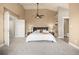Spacious main bedroom with vaulted ceilings and access to a walk-in closet and en-suite bathroom at 16434 Homestead Ct, Parker, CO 80134