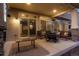 Covered back patio offering a cozy outdoor living space with seating and a view of the yard at 26322 E 2Nd Ave, Aurora, CO 80018