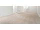 Spacious basement featuring plush carpeting and multiple entryways, creating a welcoming and versatile space at 26322 E 2Nd Ave, Aurora, CO 80018