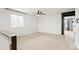 A bonus room with carpeted floors, a ceiling fan, and a window letting in lots of light at 26322 E 2Nd Ave, Aurora, CO 80018