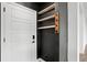 Welcoming entryway featuring custom shelves and a convenient coat rack upon entering at 26322 E 2Nd Ave, Aurora, CO 80018