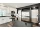 Modern kitchen with white cabinets, stainless steel appliances, and a dark island at 26322 E 2Nd Ave, Aurora, CO 80018