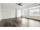 Bright and airy living room featuring hardwood floors and large windows allowing ample sunlight at 26322 E 2Nd Ave, Aurora, CO 80018