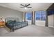 Serene main bedroom featuring a spacious layout, large windows and a cozy bed at 26322 E 2Nd Ave, Aurora, CO 80018