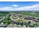 Mixed use aerial view featuring residential homes, shopping, highway access, and green space at 11575 Wilson Cir, Parker, CO 80134
