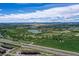 Expansive aerial view of a community with parks, green spaces, trails, and easy highway access at 11575 Wilson Cir, Parker, CO 80134