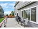 Wide deck featuring outdoor seating and a grill for outdoor dining and entertaining at 11575 Wilson Cir, Parker, CO 80134