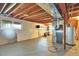 Unfinished basement ready for customization with water heater, furnace, and workout equipment at 11575 Wilson Cir, Parker, CO 80134