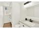 Modern bathroom featuring a vanity with sink and a laundry room with a washer/dryer at 11575 Wilson Cir, Parker, CO 80134