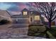 Charming two-story home featuring a three car garage and manicured front lawn at 11575 Wilson Cir, Parker, CO 80134