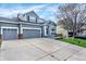 Beautiful two-story home featuring a three-car garage and manicured front lawn at 11575 Wilson Cir, Parker, CO 80134