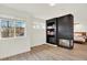 Cozy living room showcases a modern fireplace, built-in shelving and lots of natural light at 11575 Wilson Cir, Parker, CO 80134