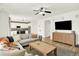 Bright, open living room with modern decor and light wood floors throughout at 11575 Wilson Cir, Parker, CO 80134